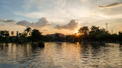 Fototapeta na wymiar Sunset over Lake in Jutujak Park