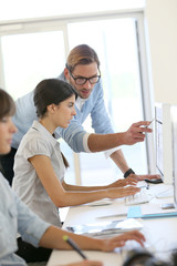 Obraz premium Creative people working in office on computer