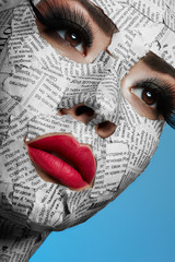 Model with Newspaper on Face