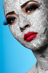Girl with Newspaper on Face