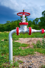 Fototapeta na wymiar Oil pipeline with the tap valve