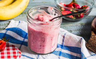 strawberry-banana ice cream in a glass fruit dessert, summer