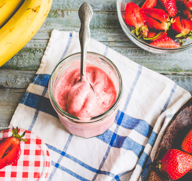 strawberry-banana ice cream in a glass fruit dessert, summer