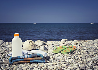 Summer concept with swimming accessories and blur sea on backgro