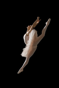Fototapeta Ballerina in jump isolated on black