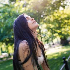 Young beautiful woman relaxing in Central Park. New York City.