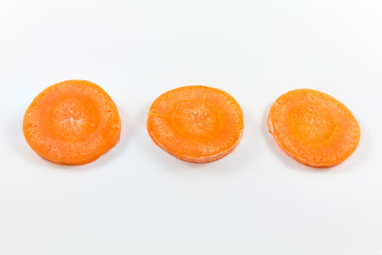 Fresh carrot slice isolated on a white background