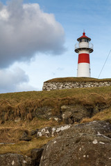 Skansin lighthouse with grass covered rocks