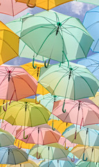 Fototapeta na wymiar Pastel Umbrellas in sunshine day
