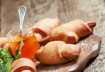 Homemade cookies mini croissants with apricot jam and mint, sele