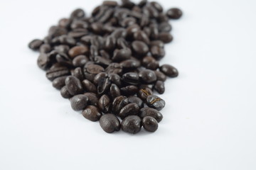 Roasted coffee beans on white background
