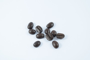 Roasted coffee beans on white background