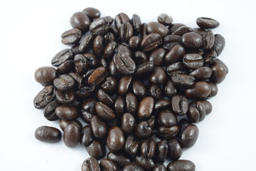 Roasted coffee beans on white background