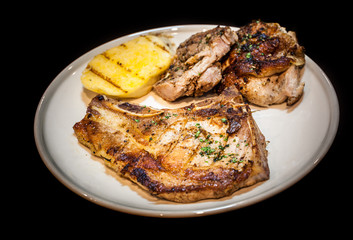 grilled steak in white dish,isolate background,pork chop meat in dish