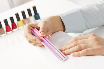 Woman using nailfile