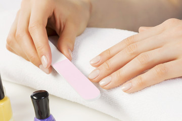 Woman using nailfile