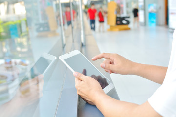 Male Hand using Mobile Phone in Modern Building Background