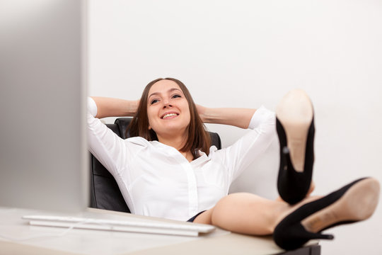 Relaxed businesswoman at her desk