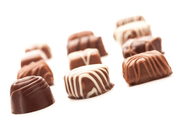 Chocolate pralines over white isolated background