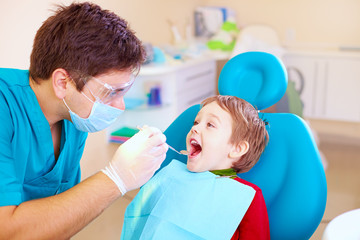 small kid, patient visiting specialist in dental clinic © Olesia Bilkei