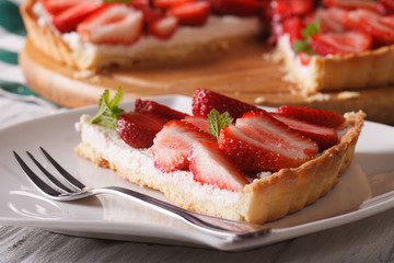 piece of strawberry tart on a plate macro. horizontal
