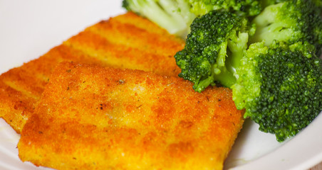 fried breaded fish fillets with broccoli