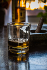 glass of whiskey and cigar