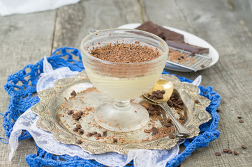 Vanilla panna cotta with chocolate on a wooden background. selec