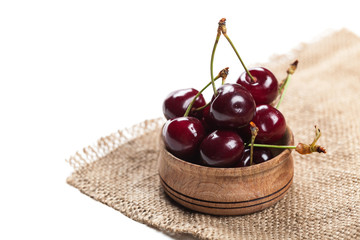 cherries in wooden bowl