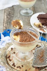 Vanilla panna cotta with chocolate on a wooden background. selec