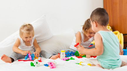 Fototapeta premium little children playing on bed