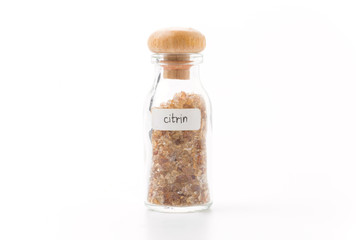 citrine in glass bottle