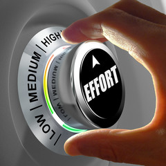 Hand rotating a button and selecting the level of effort.
