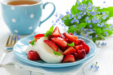 Dessert of strawberries and cheese.