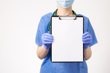 Doctor showing blank clipboard