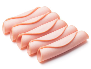 cooked boiled ham sausage or rolled bologna slices isolated on w © Natika