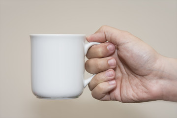 Hand Holding A Mug