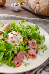 Lamb's lettuce salad with poached egg and nuts