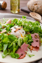 Lamb's lettuce salad with poached egg and nuts