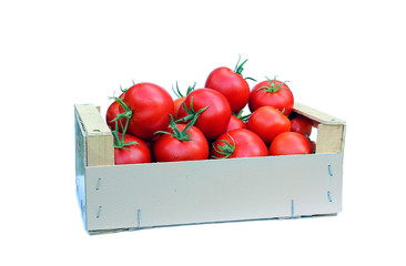 Red tomatoes in a wooden box