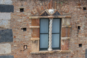 Fototapeta na wymiar old window and rocky wall