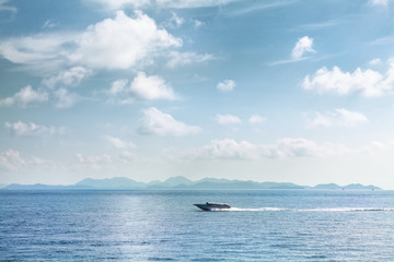 Speed boat moving on blue tropical sea Thailand