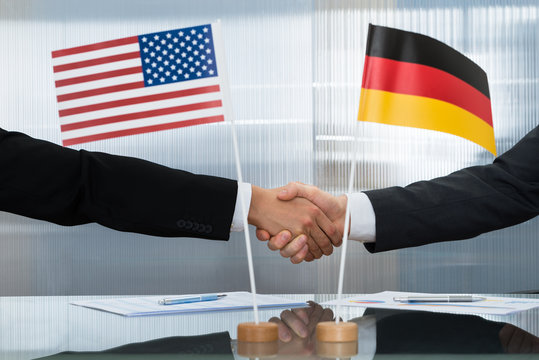 American And German Businessman Shaking Hands