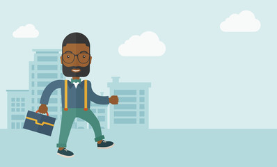 Young man walking through the city's street with his briefcase.