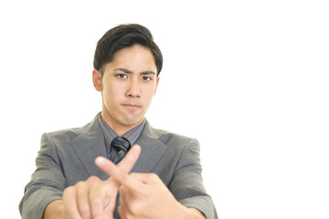 禁止の意思表示をする男性