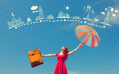 girl in red dress with suitcase and umbrella