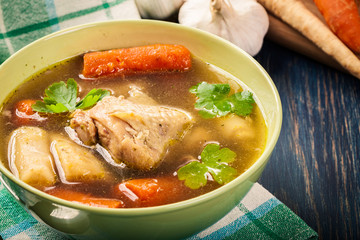 Chicken broth with noodles and carrot