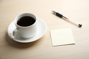 Blank note with ball pen and coffee