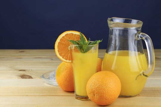 Domestic fresh orange juice in a glass jar 
