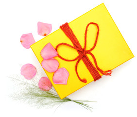 Gift box with red ribbon and rose